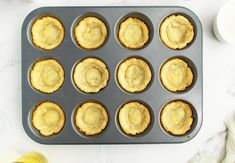 muffins sitting in a pan on top of a table