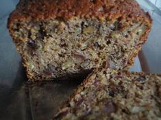 a loaf of banana nut bread cut in half