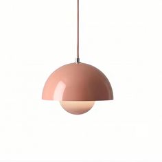 a pink light hanging from a brown cord