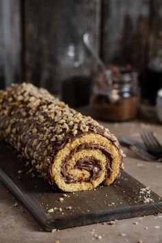 a chocolate and nutella roll on a cutting board