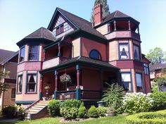 an old victorian style house with many windows