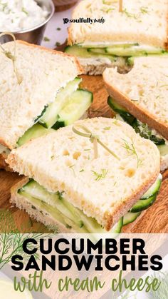 cucumber sandwiches with cream cheese and dill pickles on a cutting board