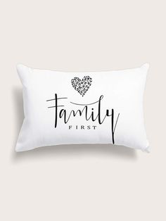 a white pillow with the word family first printed on it and a heart in the middle