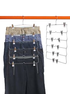 several pairs of pants hanging on a clothes line