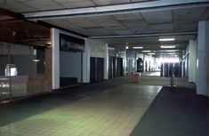 an empty building with no people in the room or on the floor, and only one person