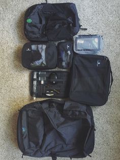 four pieces of luggage sitting on the floor next to each other, all packed up