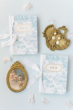 the wedding stationery is laid out on top of each other, including a photo frame