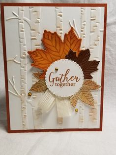 a card with leaves on it that says gather together