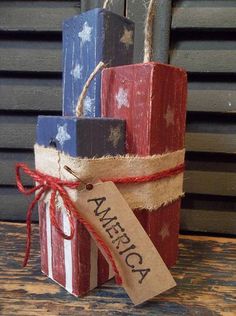 an american flag gift wrapped in twine and tied up with a tag that says america