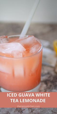 iced guava white tea lemonade in a glass on a marble table with text overlay