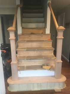 the stairs are being built to match the floor in this house's entryway