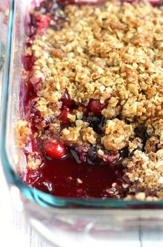 a blue casserole with crumbled toppings in a glass dish