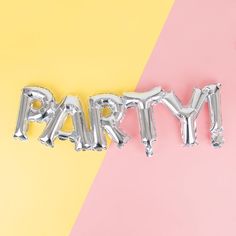 the word party spelled with silver balloons on a pastel and yellow colored background,