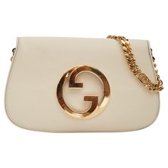 Coming from the House's archives, a round shaped version of the Interlocking G logo is reintroduced for Gucci Love Parade. Made from white leather, this shoulder bag is completed by a delicate chain strap. Leather strap is included. The bag features white leather, gold-toned hardware, leather lining, round interlocking GG, magnetic closure, an interlocking GG chain and an interior zip pocket. Color: White Material: Leather Item Code: 699268 Measures: H 7” x L 11” x D 1” Drop: 7” (gold chain) & 1 Designer White Gucci Shoulder Bag, Modern White Gucci Bag, White Leather Gucci Shoulder Bag, White Gucci Bag, Gucci Leather Shoulder Bag With Gold-tone Hardware, Gucci Leather, Leather Items, Chain Strap, Fashion Handbags