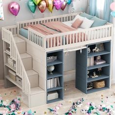 there is a loft bed with stairs to the top and shelves below it that are filled with confetti