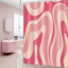 a bathroom with a pink shower curtain and bathtub in the background is a large window