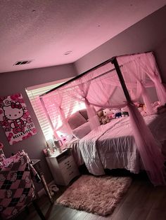 a hello kitty themed bedroom with pink walls