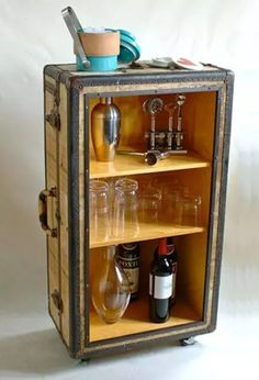 an old suitcase with some bottles in it and a toothbrush on the top shelf