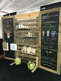 two wooden signs with chalk writing on them next to each other and some green buckets