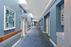 a long hallway with blue walls and white trim