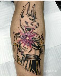 a tattoo on the leg of a man with an egyptian cat holding a pink flower