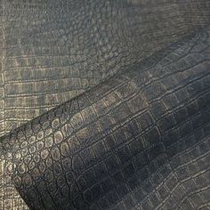 an elephant skin textured up close to the camera