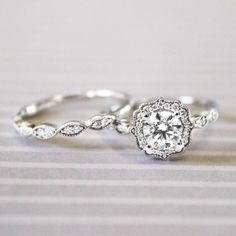 two wedding rings with diamonds on them