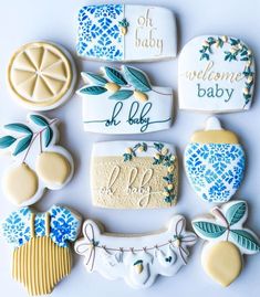 decorated cookies are arranged in the shape of a baby's name and birth date