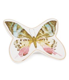 a white butterfly with pink and yellow wings