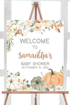 a welcome sign with flowers and pumpkins on it in front of a white background