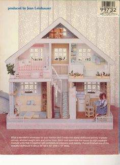 an advertisement for a doll house with a woman sitting in it