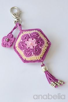 a crocheted key chain with a flower on it