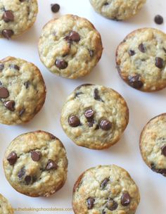 chocolate chip cookies are arranged on a white surface