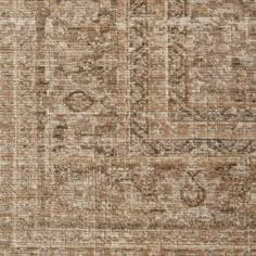 an area rug with brown and beige colors