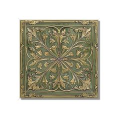 a green and gold tile with an ornate design on the back side, in square shape