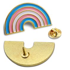 a pin with a rainbow in the middle and a gold plated lapel back