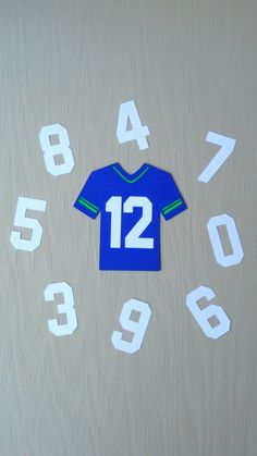 a clock with numbers and a jersey on it