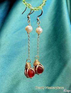 Elevate your style with our stunning Carnelian Earrings with Pearls and Gold Twines. Crafted from natural gems of carnelian and freshwater pearls, these fantastic dangle earrings feature elegant gold hooks for a touch of luxury. Their distinctive design makes them a perfect accessory for any occasion, whether a Christmas night or a casual gathering. Adorn yourself with these eye-catching earrings that blend earthy tones with a hint of glamour. Treat yourself or gift them to someone special today Earrings With Pearls, Gold Hooks, Carnelian Earrings, Christmas Night, Jewelry Unique, Hook Earrings, Earthy Tones, Freshwater Pearls, Jewelry Earrings Dangle