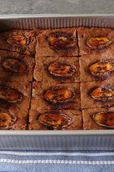 a pan filled with brownies sitting on top of a table