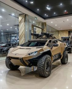 an armored vehicle is on display in a showroom