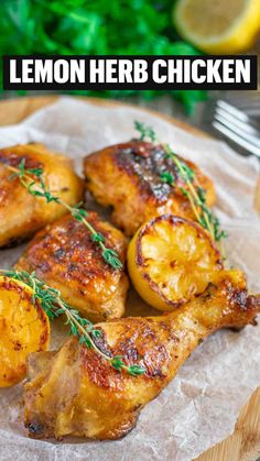 grilled chicken with lemons and herbs on a wooden plate