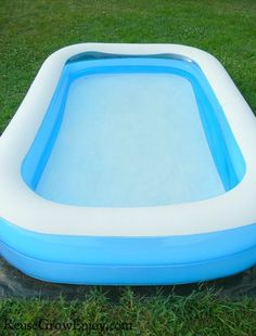 an inflatable swimming pool on the grass