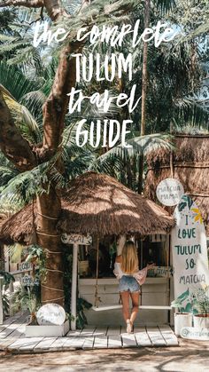 a woman standing in front of a palm tree with the words, the complete tulum travel guide