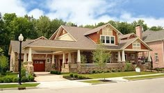 a large house with lots of windows and landscaping