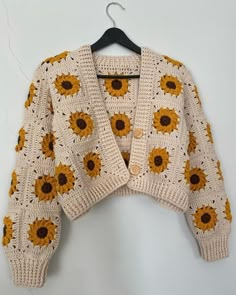 a knitted sweater with sunflowers on it