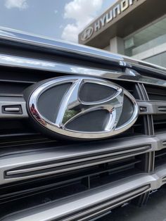 the front grille of a car with an emblem on it