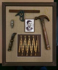 an old framed photo with some tools and a man's name on it,