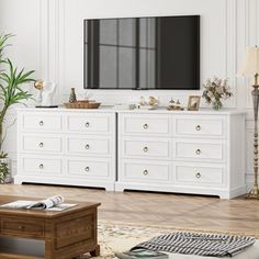 a living room with white furniture and a flat screen tv