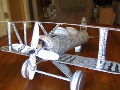 a model airplane sitting on top of a wooden table