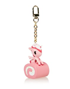 a pink keychain with a little pony on it's back and a chain hanging from the front